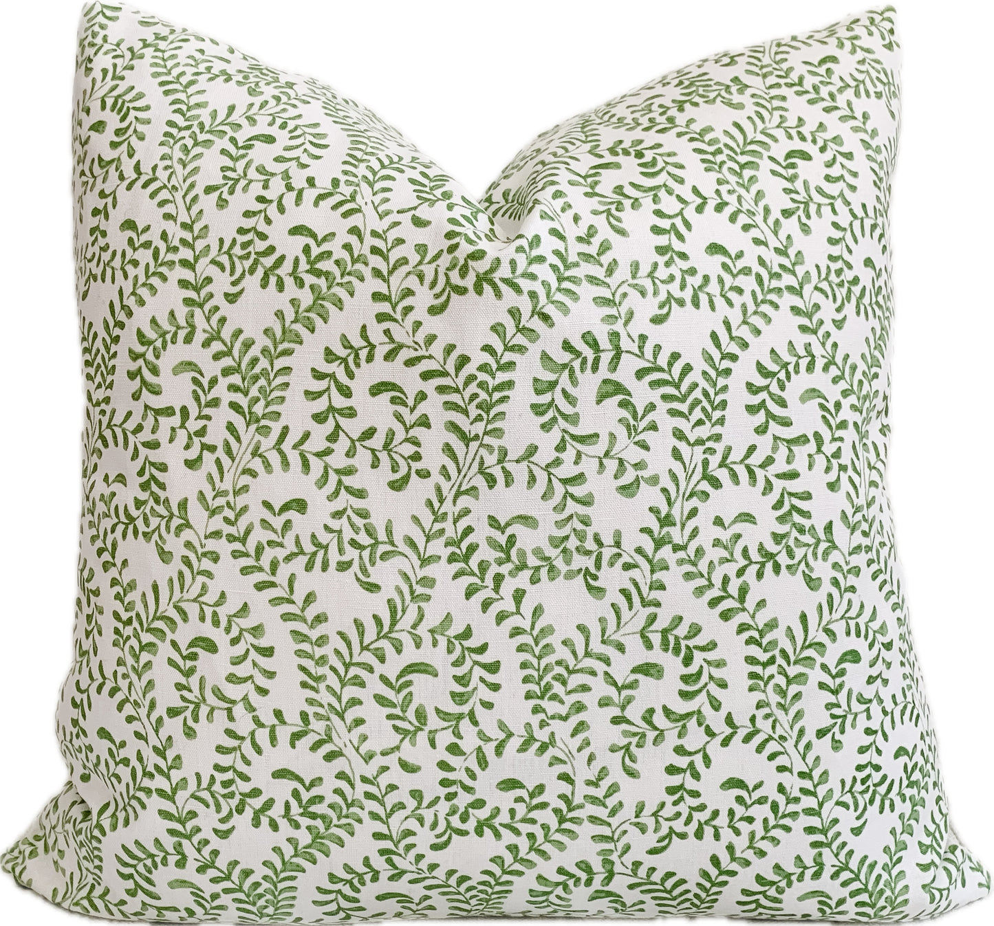 Green and white designer pillow cover with vine motif.