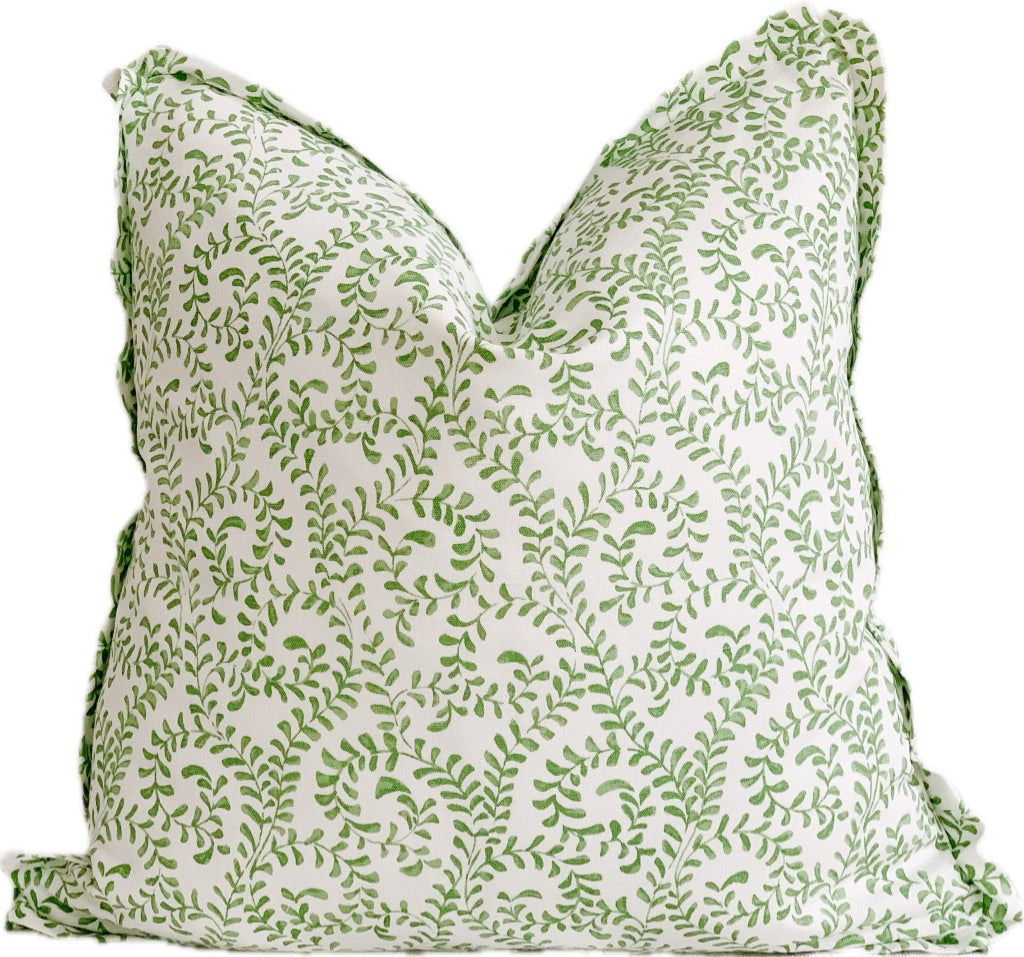 Square decorative pillow with flange. Green vine motif on a white background.