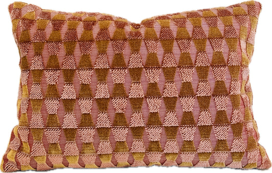Decorative pillow with geometric pattern in pink and brown on a white background