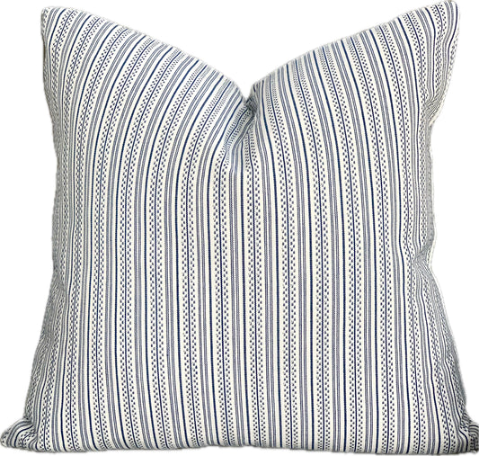 Square decorative pillow with thin navy blue stripes on a white background