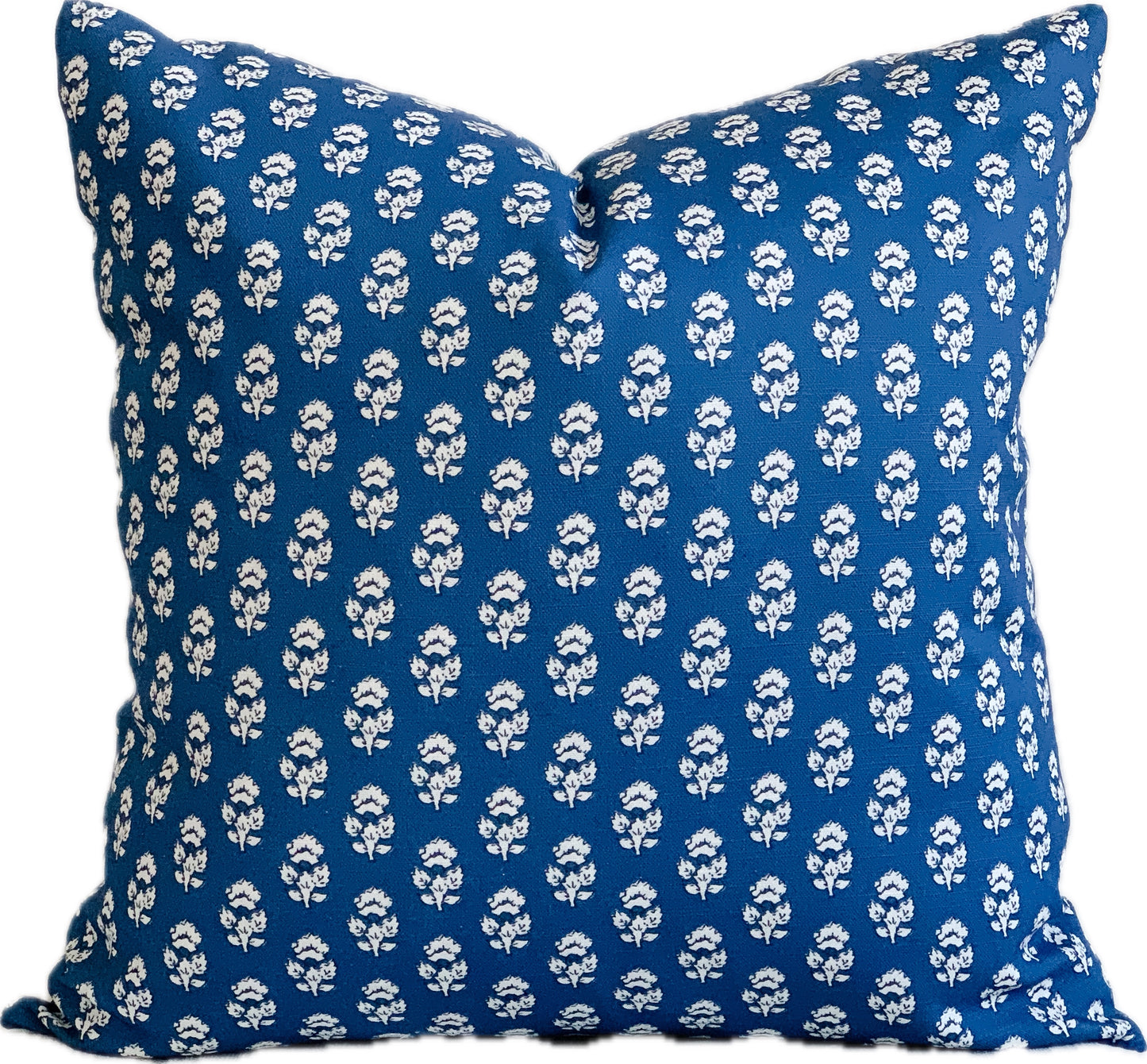 Navy blue designer square pillow with  a small white flower repeat
