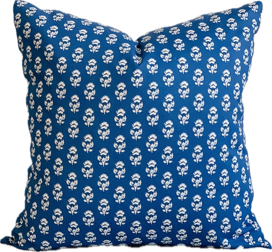 Navy blue designer square pillow with  a small white flower repeat