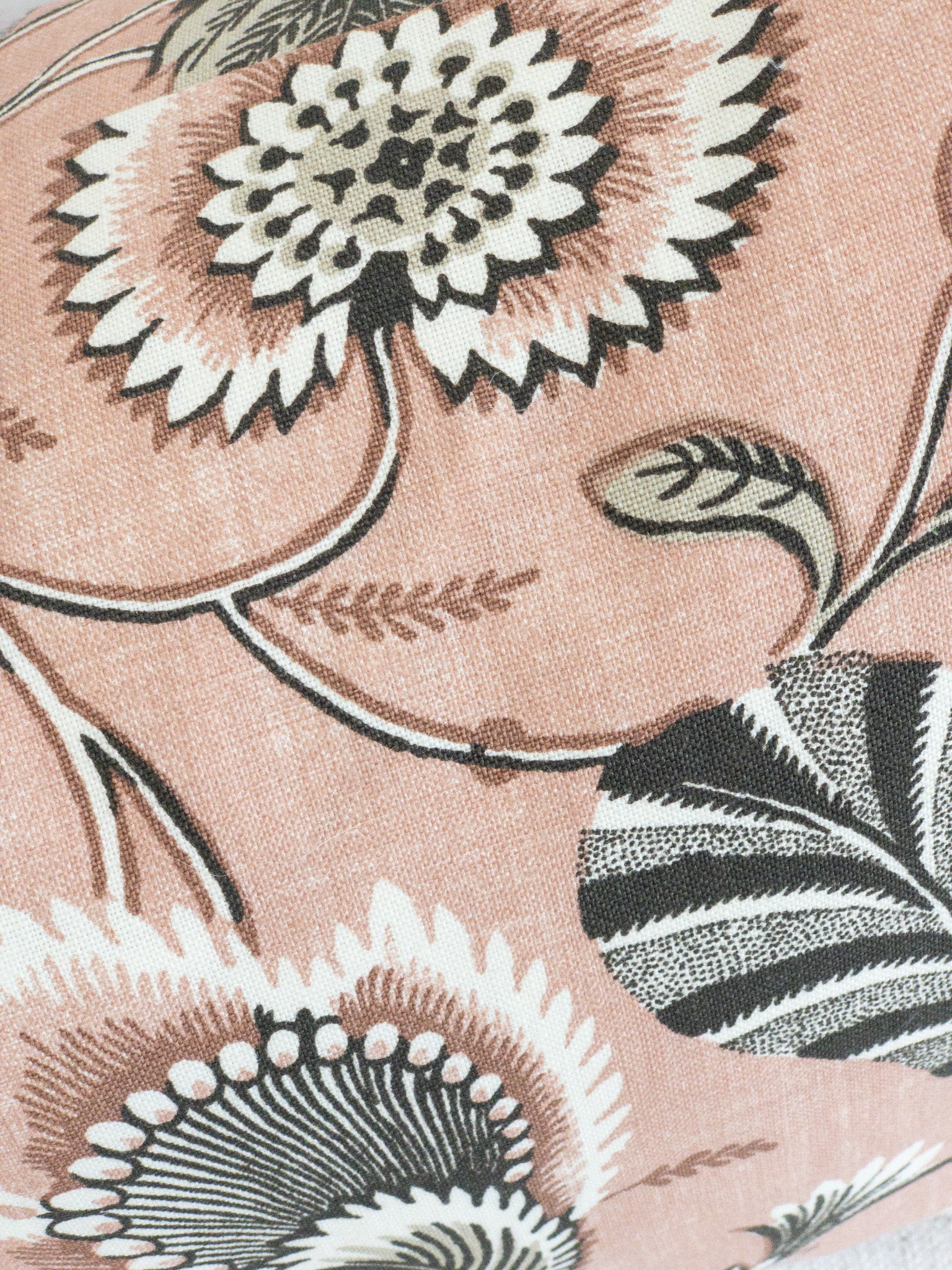 Closeup of luxury floral fabric for decorative pillow in blush pink