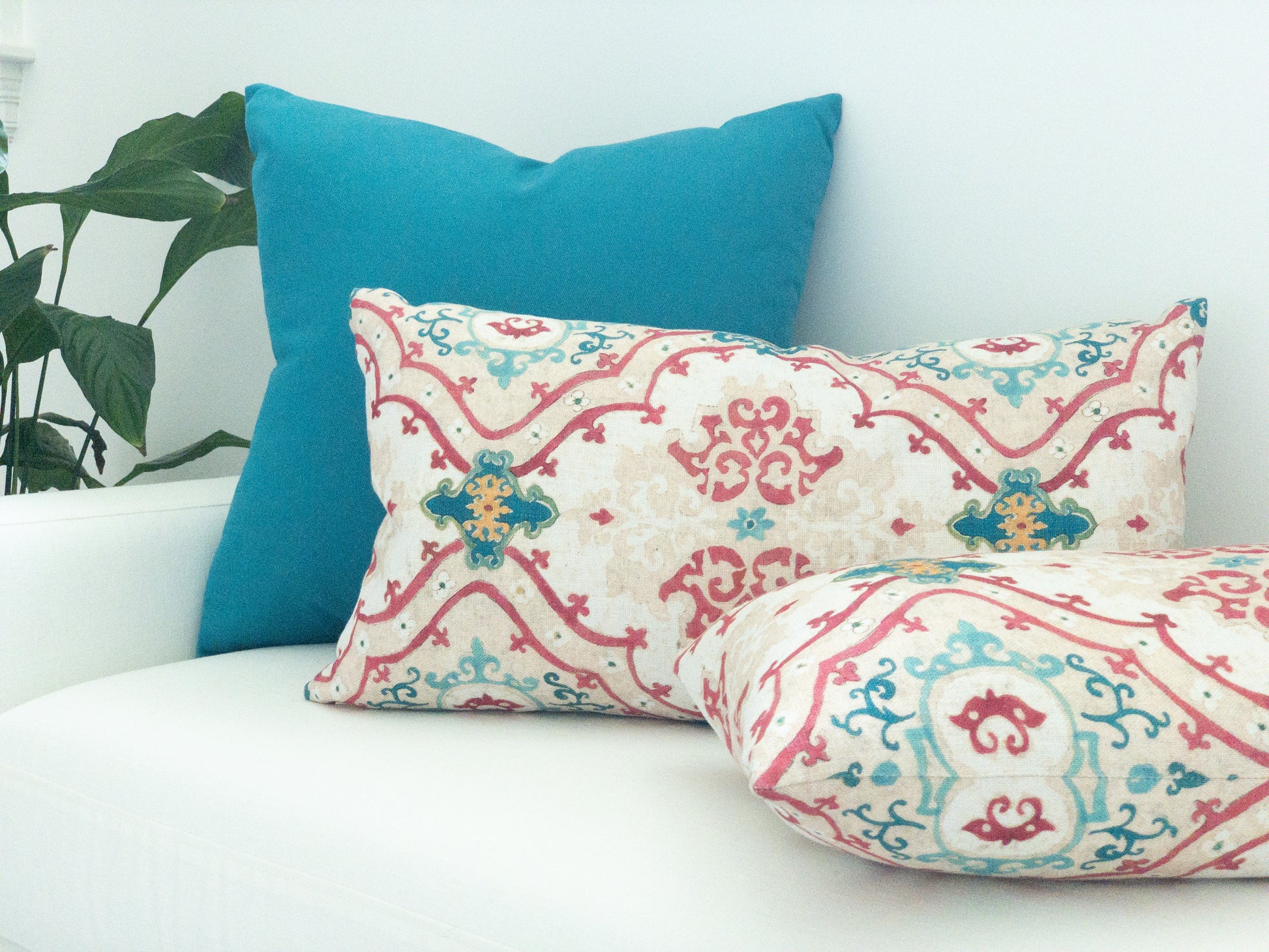 Peacock blue solid pillow with ikat lumbar pillows