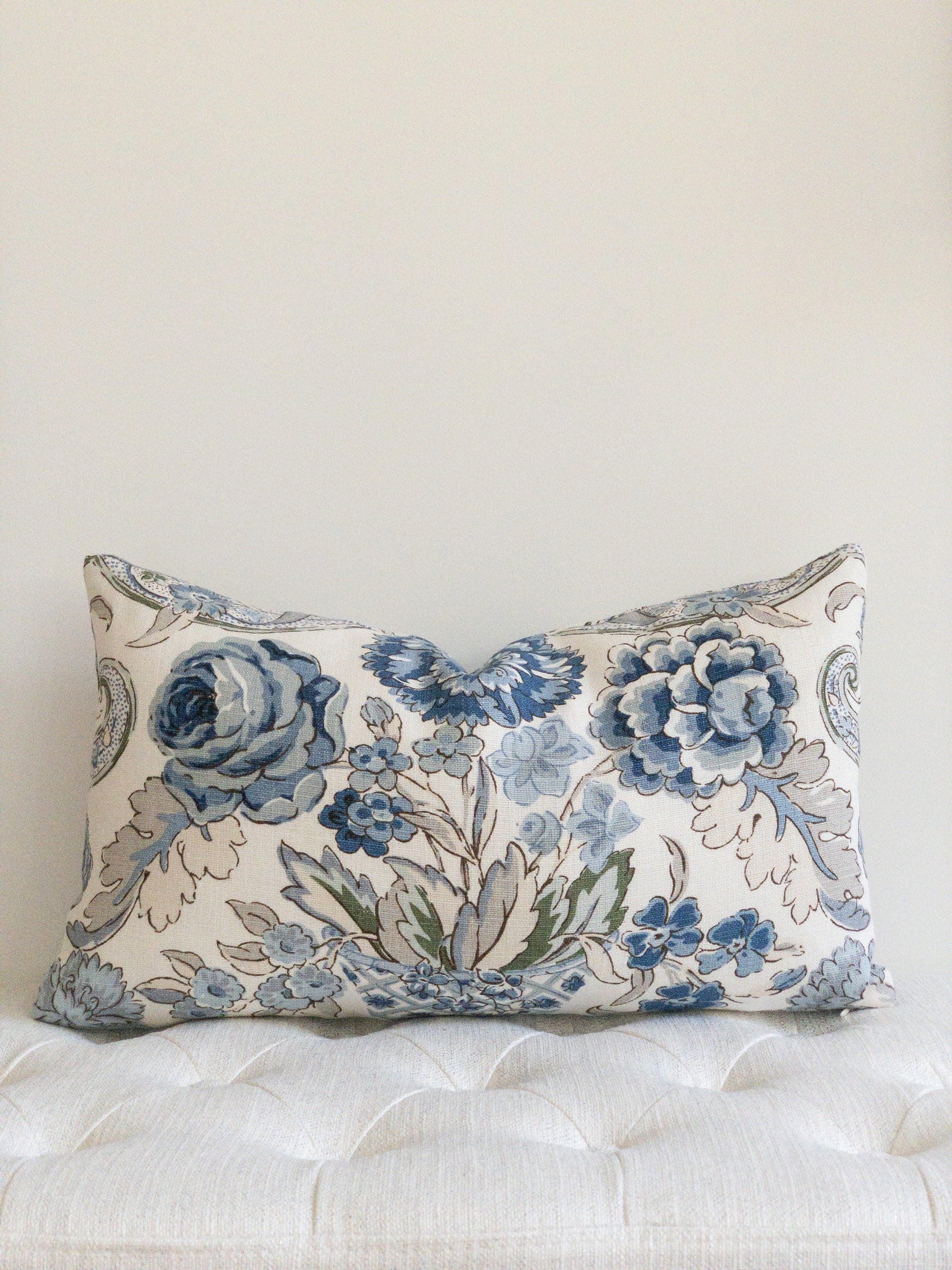 Blue and white designer floral lumbar pillow with large blue flowers