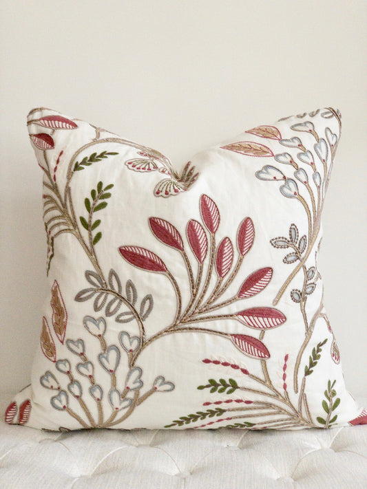 Embroidered floral designer pillow on white background with pops of blush pink.  22 x 22 inch  square