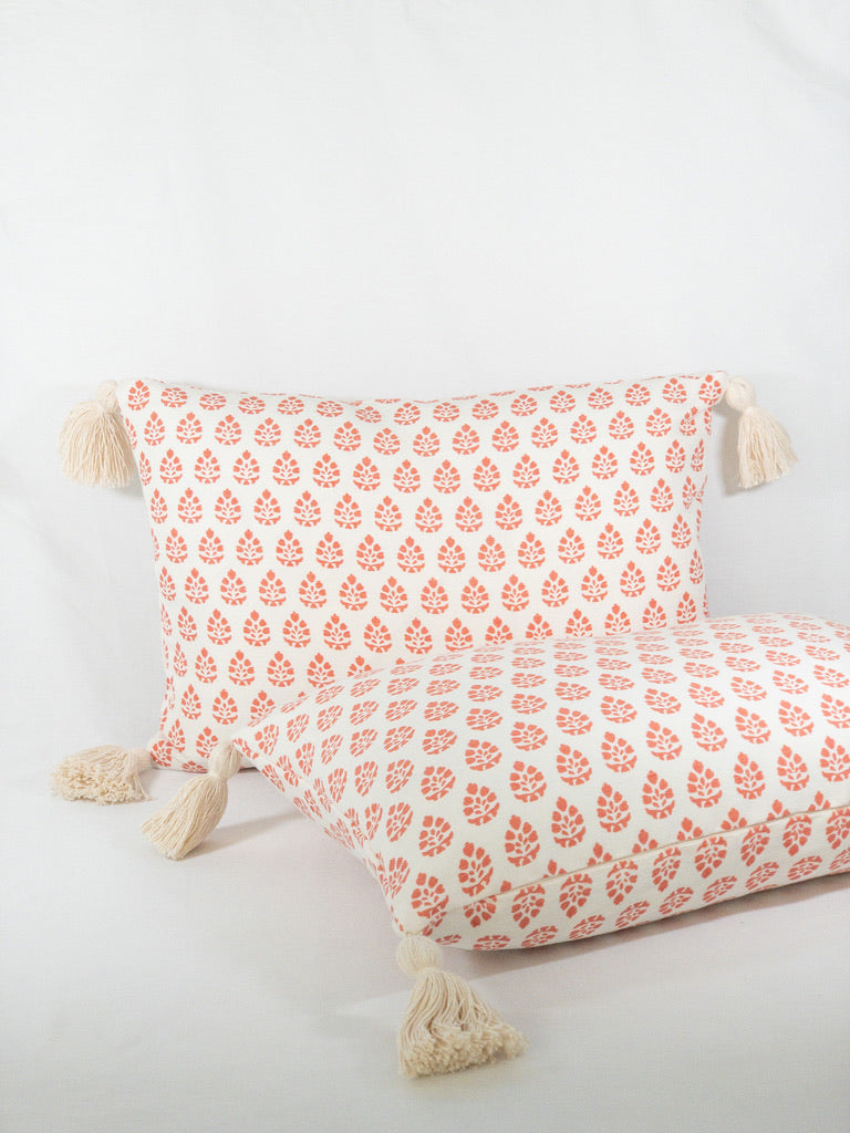 coral and white designer lumbar pillow with tassels