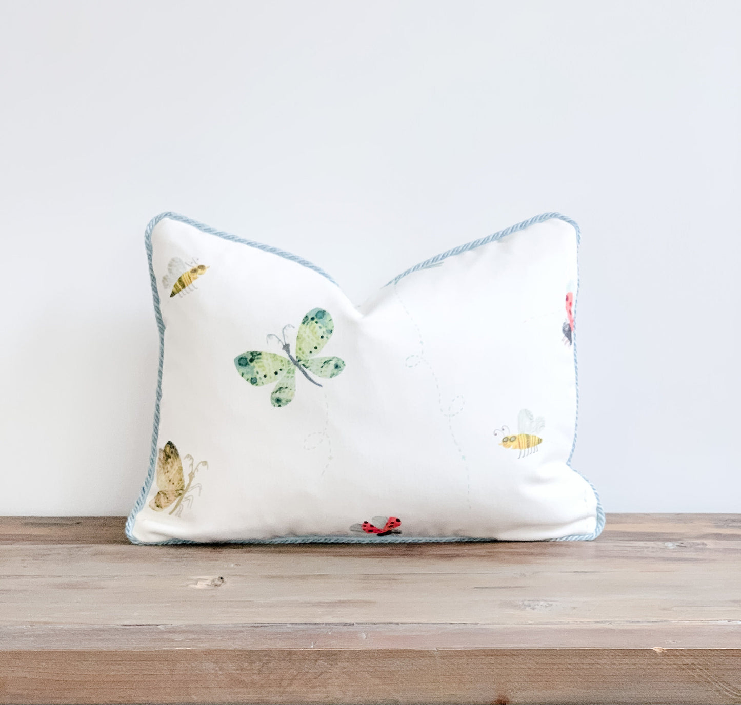 butterfly insect motif designer pillow in white