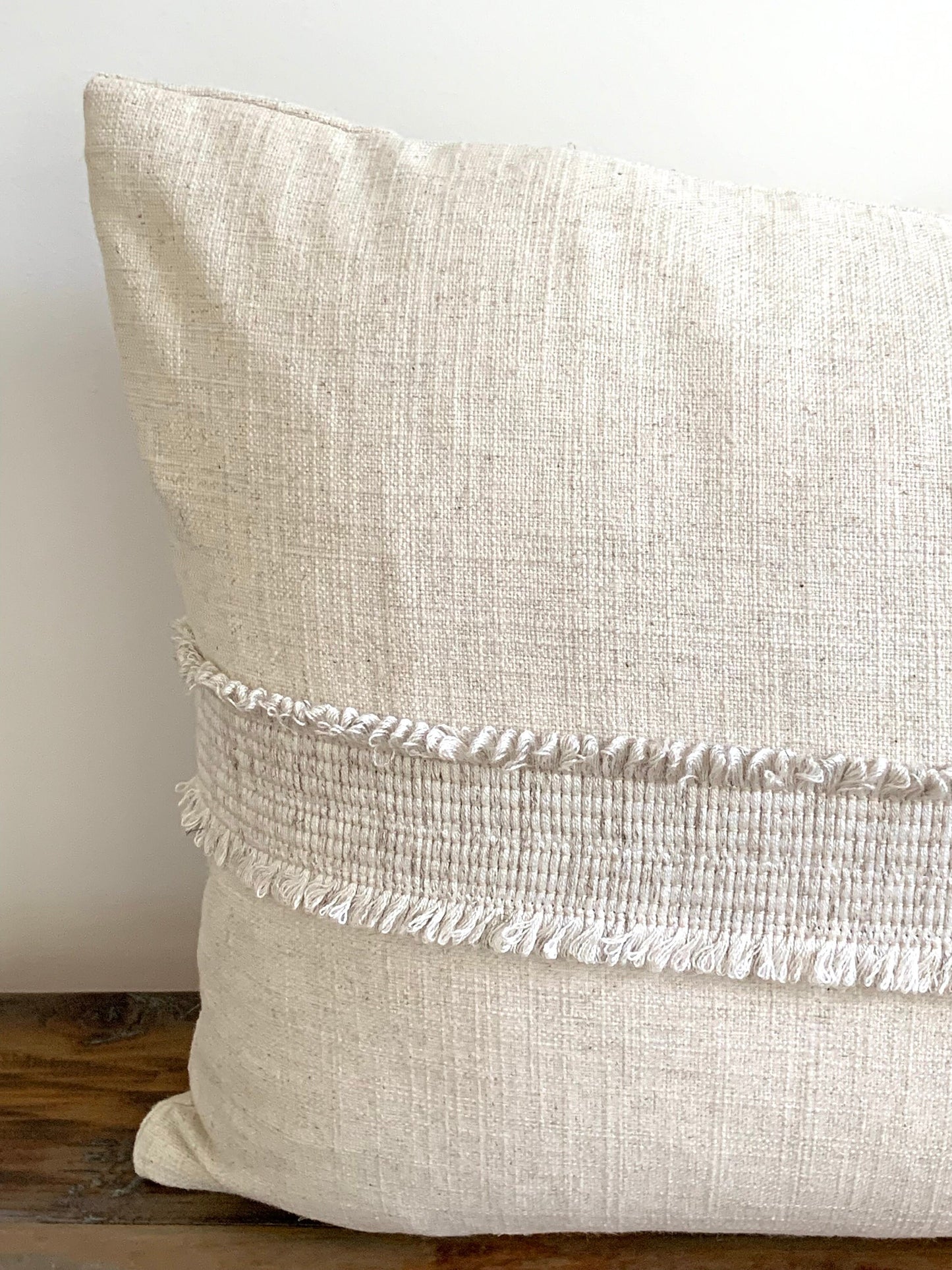 Linen lumbar pillow with decorative tape